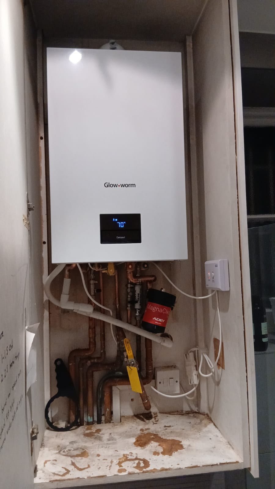 Newly installed Glow-worm MagnaClean boiler within a cupboard, showcasing KOZ Plumbing & Heating’s expertise in