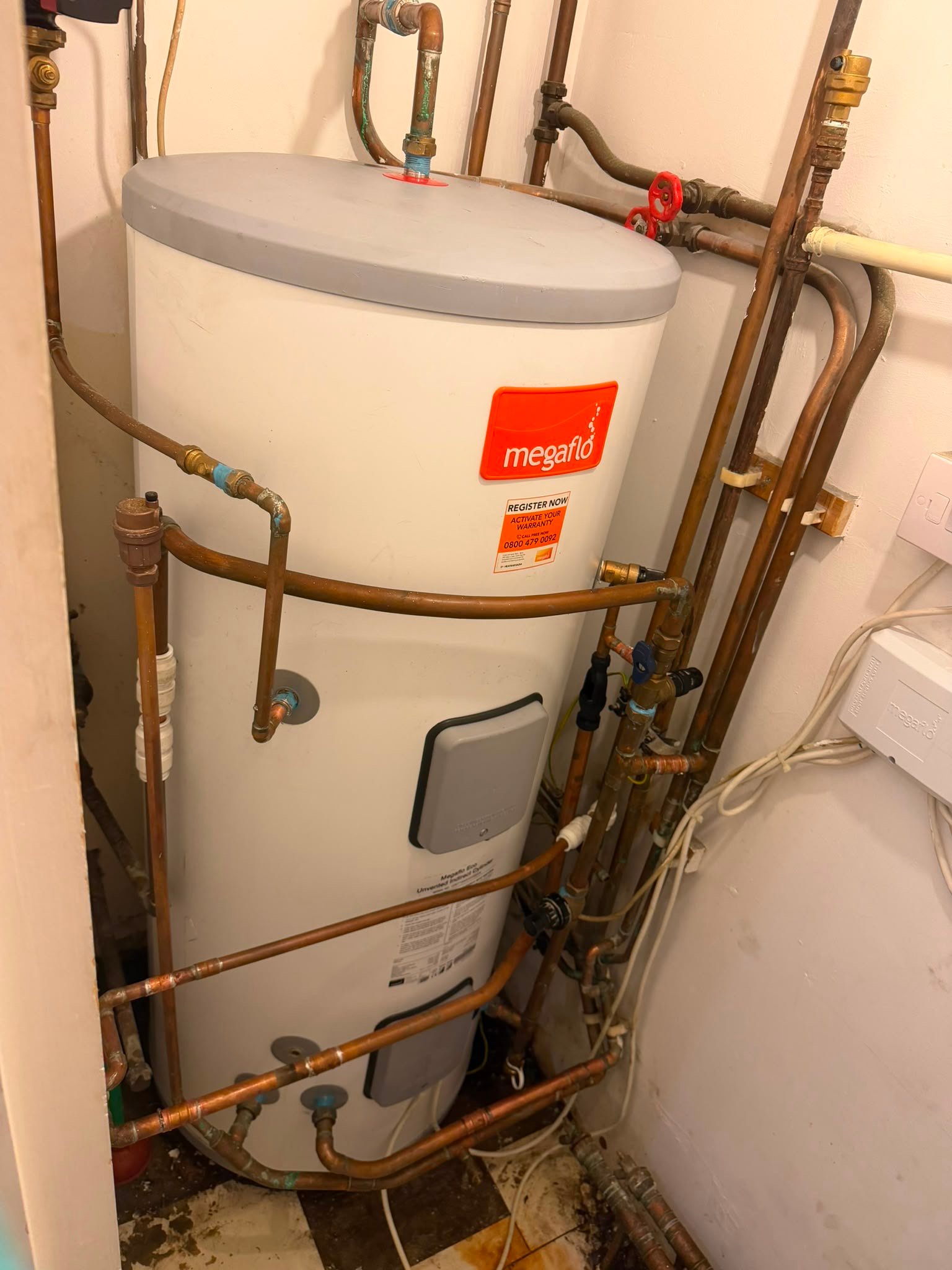 Close-up of a modern Megaflo water heater installed by KOZ Plumbing & Heating, showcasing professional