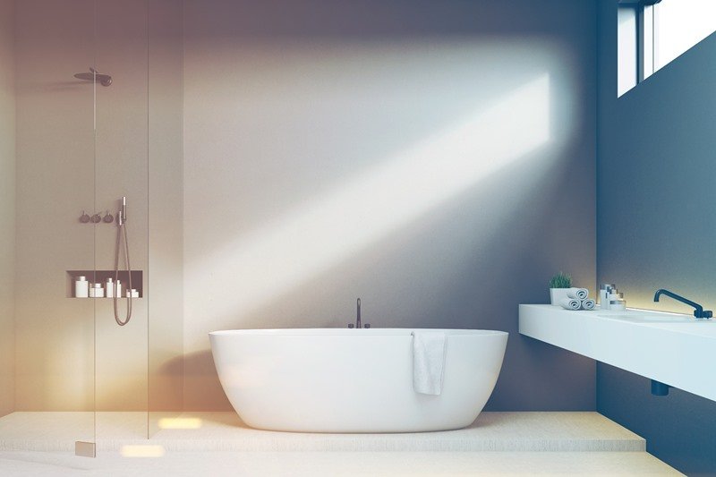 Modern bathroom design featuring a freestanding bathtub and walk-in shower, showcasing KOZ Plumbing & Heating’s