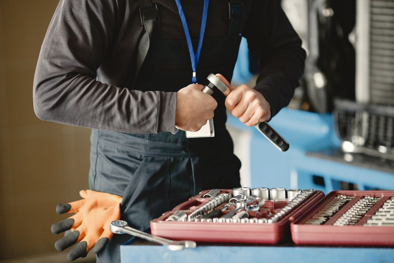 KOZ Plumbing & Heating technician using measuring tools, showcasing the reliable solutions and professional service