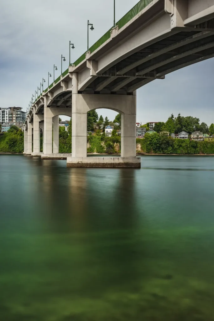 An arched bridge spanning a waterway, symbolizing KOZ Plumbing & Heating’s rapid response and reliable